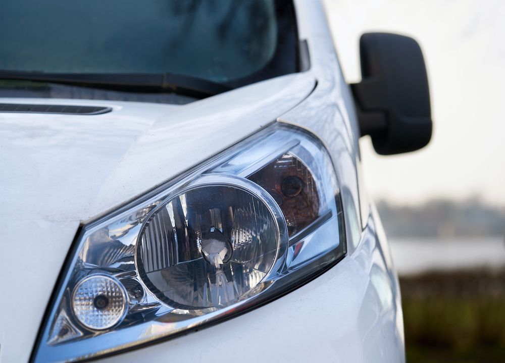 A Close Up of a White Van's Headlight — Activate Auto Electrics & Air Conditioning In Caloundra, QLD