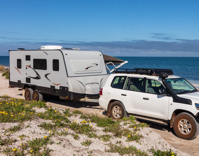 4WD Towing Caravan At Beach — Activate Auto Electrics & Air Conditioning In Caloundra, QLD