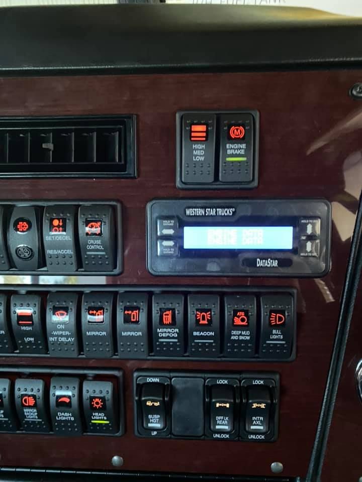 A Bunch of Electrical Switches on a Wooden Dashboard — Activate Auto Electrics & Air Conditioning In Caloundra, QLD