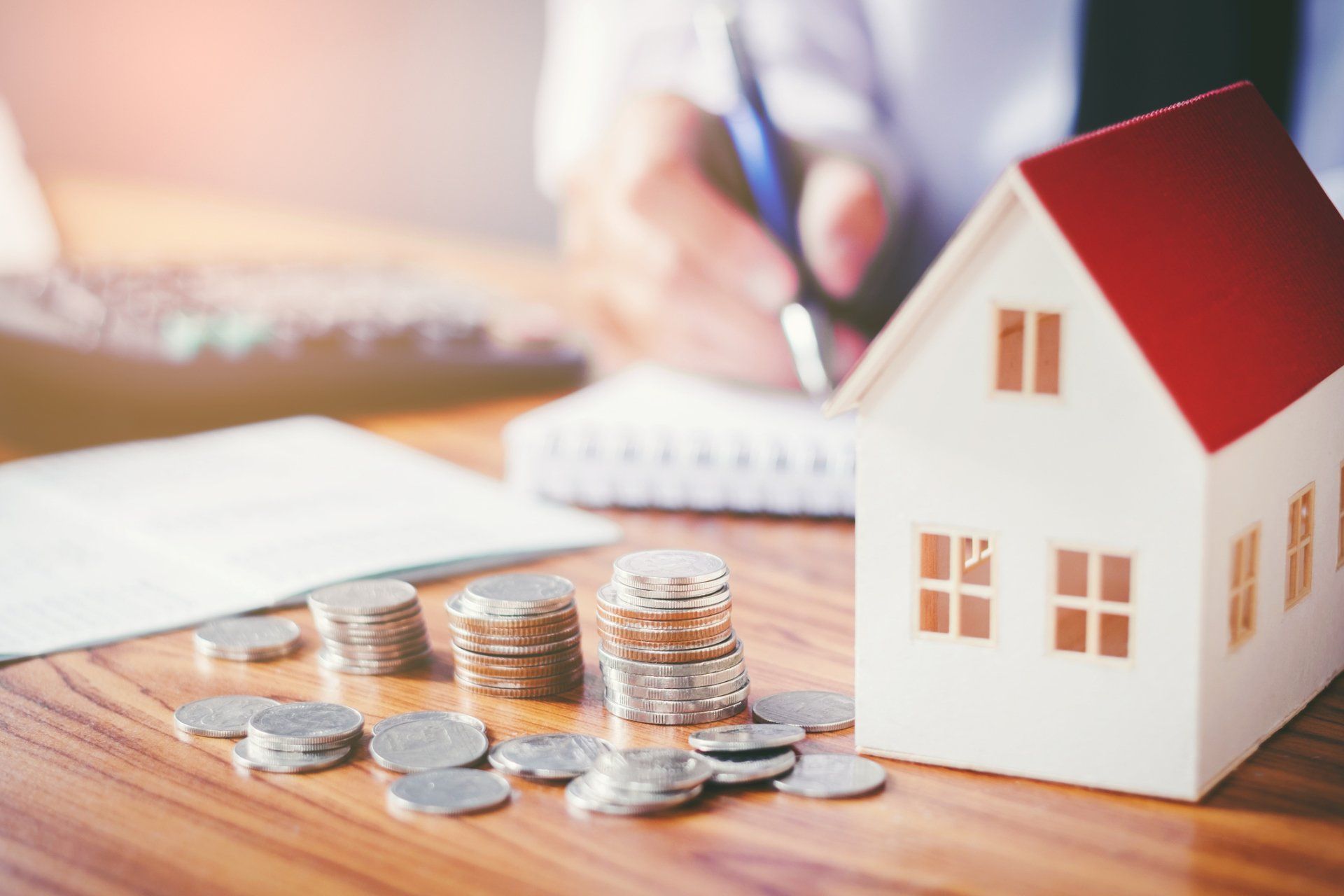 Foreclosure — Stack of Coins and Mini Model House on the Table in Aiken, SC