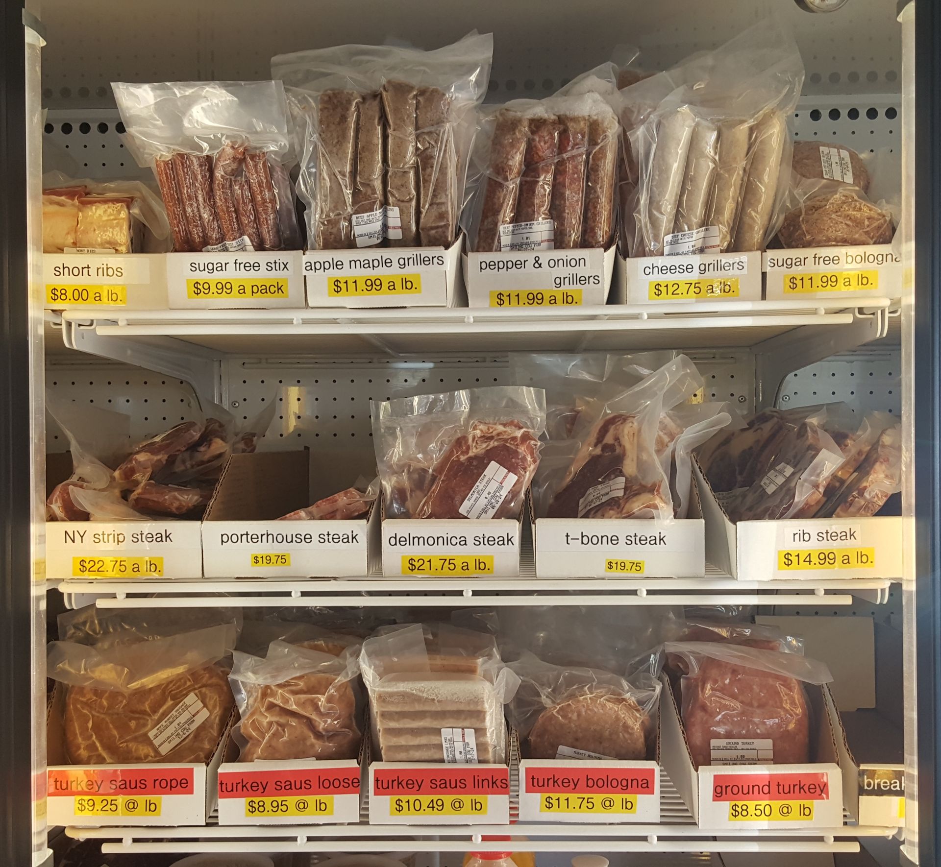 A fridge filled with a variety of food including bread