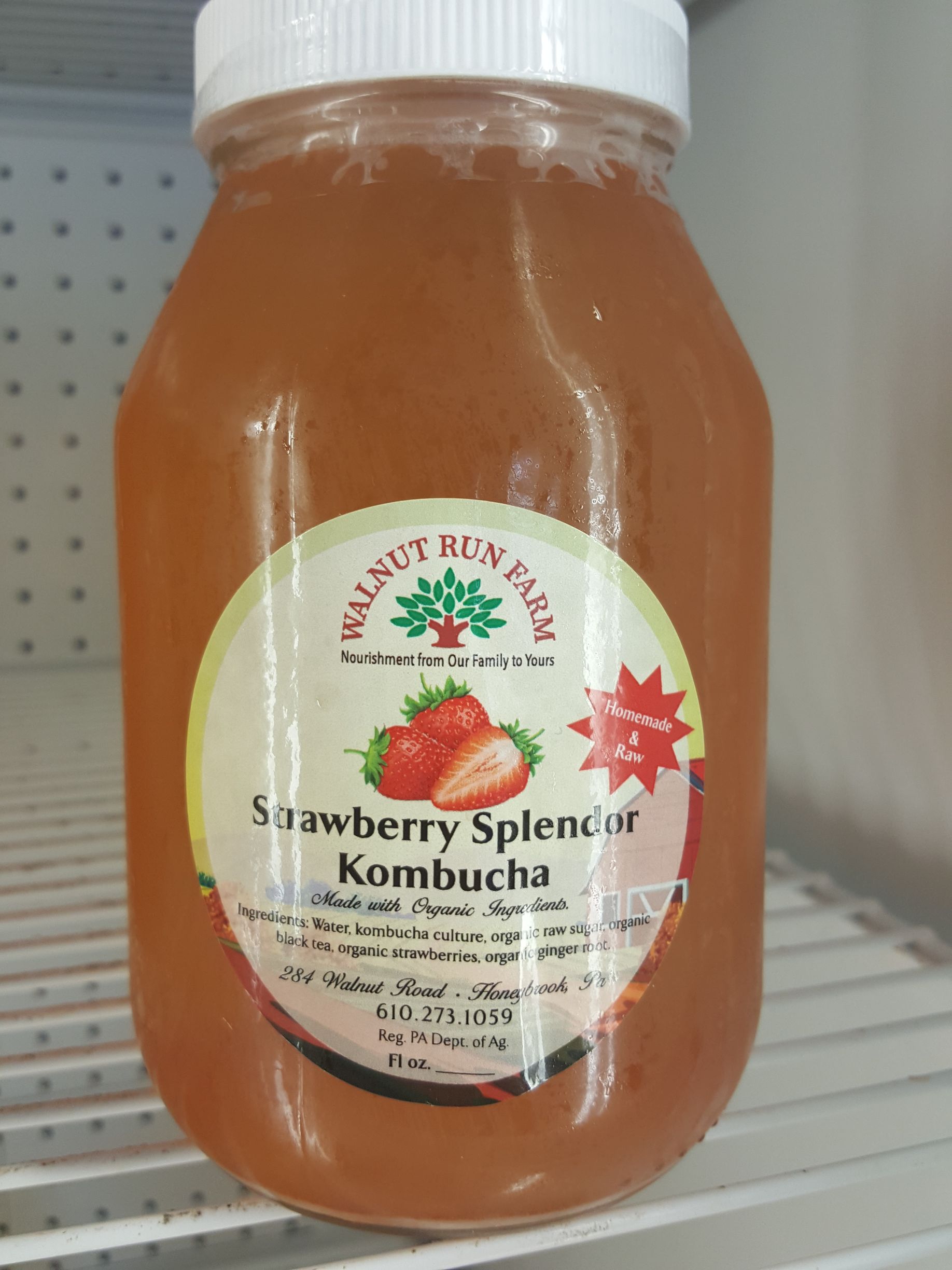 A bottle of strawberry kombucha from the smiling cow farm market