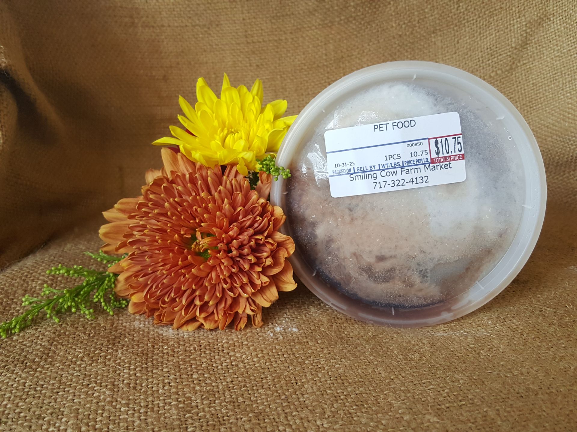 Pet food in tub beside flowers