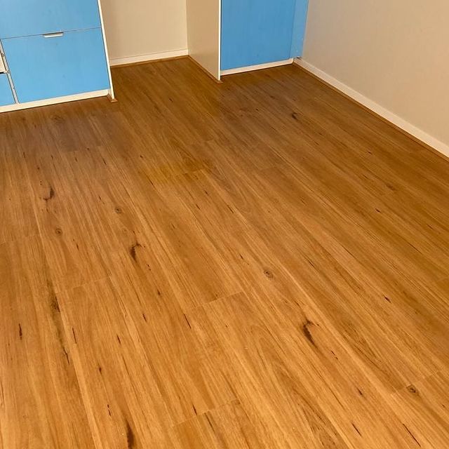 Wood Floor and Blue Cabinet — Chadstone, Vic — Eliza Flooring