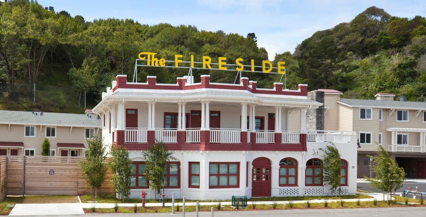 a large white and red building with the word fireside on top