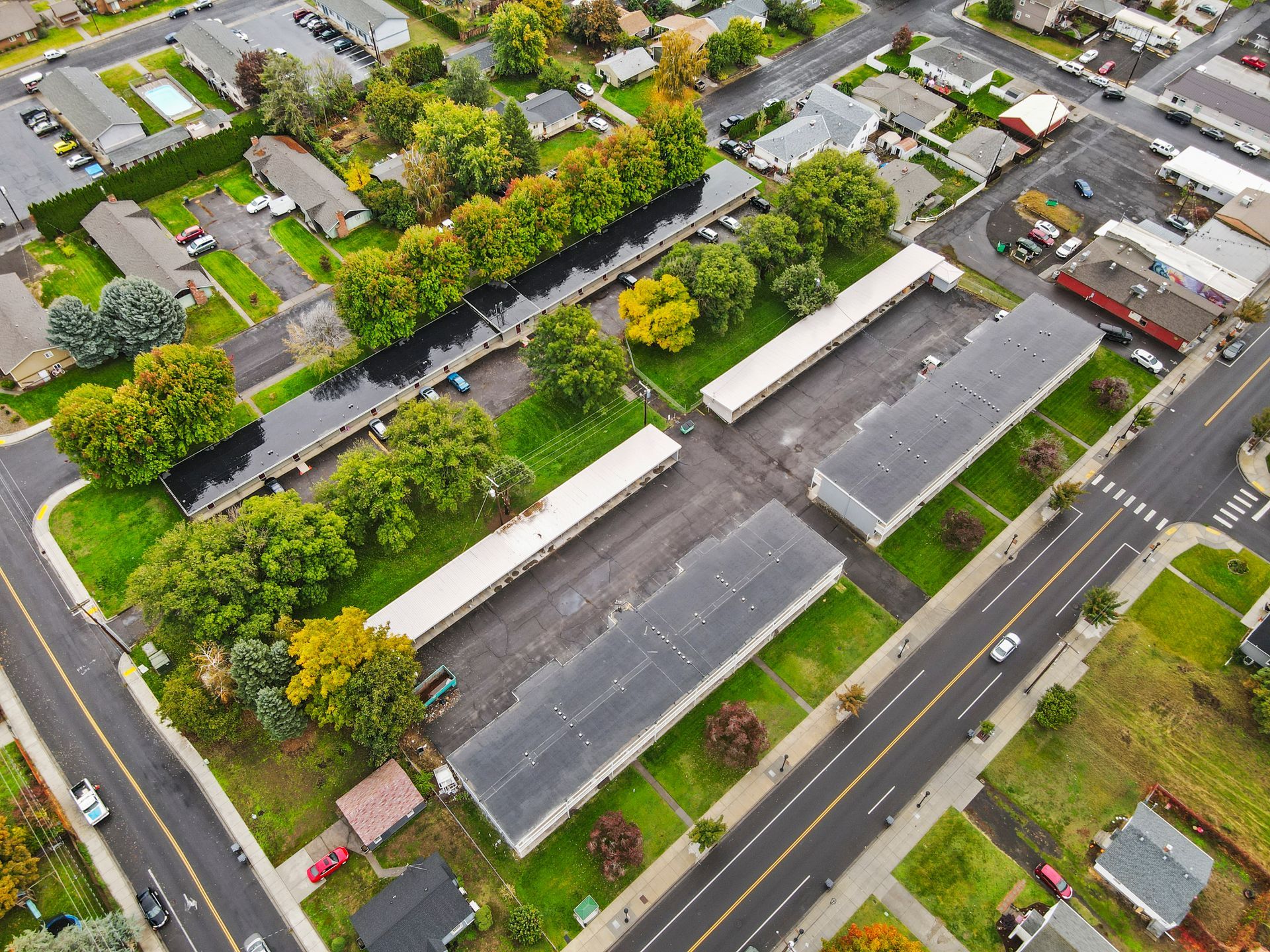 An aerial view of a residential area with lots of houses and trees