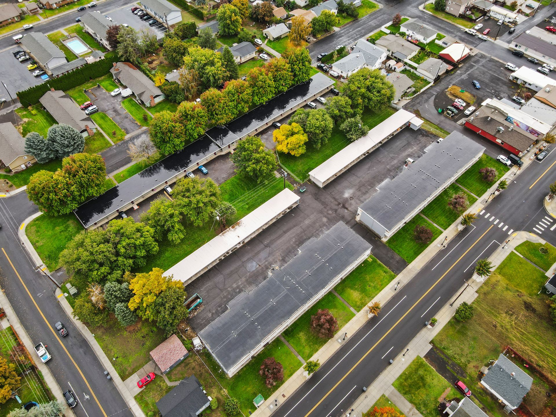 An aerial view of a residential area with lots of houses and trees.