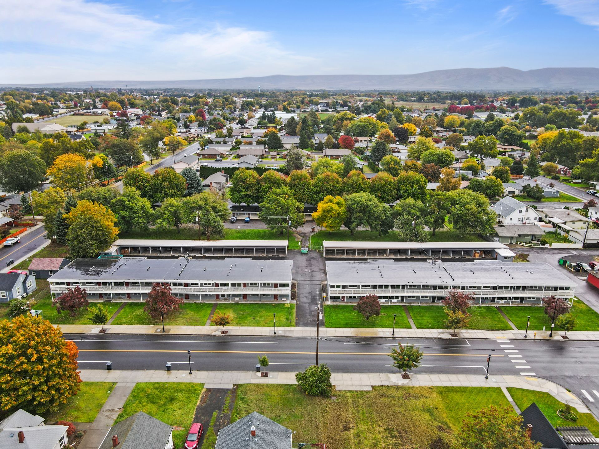 An aerial view of a residential area with houses and trees