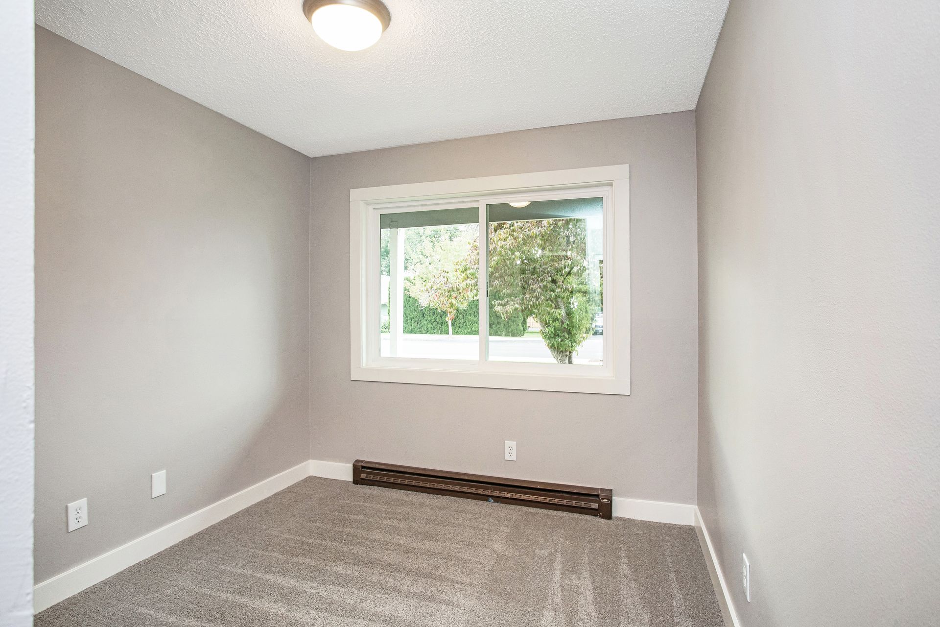 There is a large window in the middle of the room.