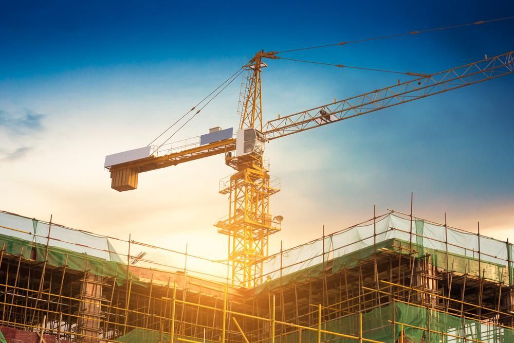A Construction Site with A Crane and A Building Under Construction — AMAC Cranes in Coolum Beach, QLD