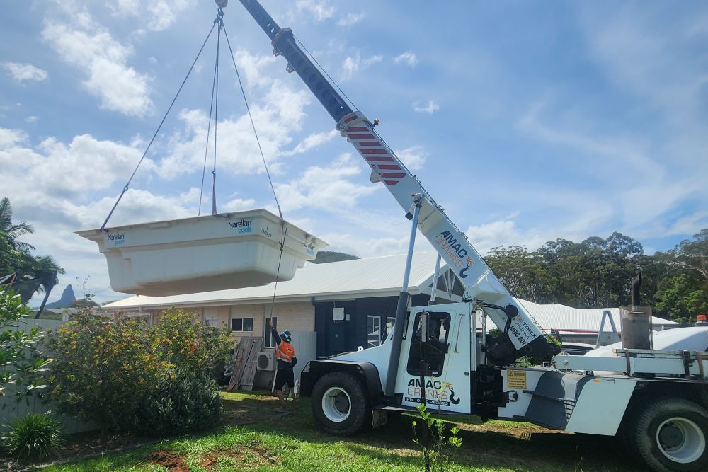 Crane lifting a pool