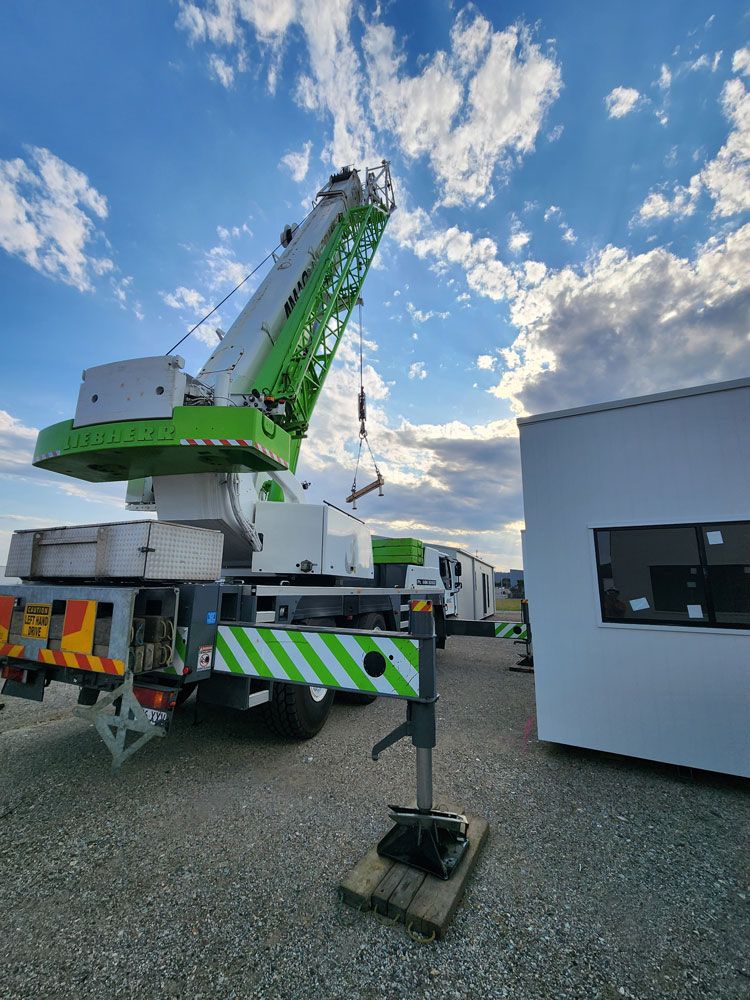 Green Builder Crane Near Construction Sitre