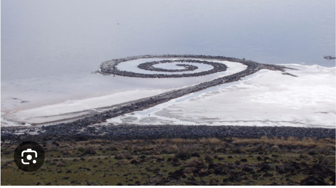 Spiral Jetty, a large earthwork art piece, extends into the Great Salt Lake, Utah.