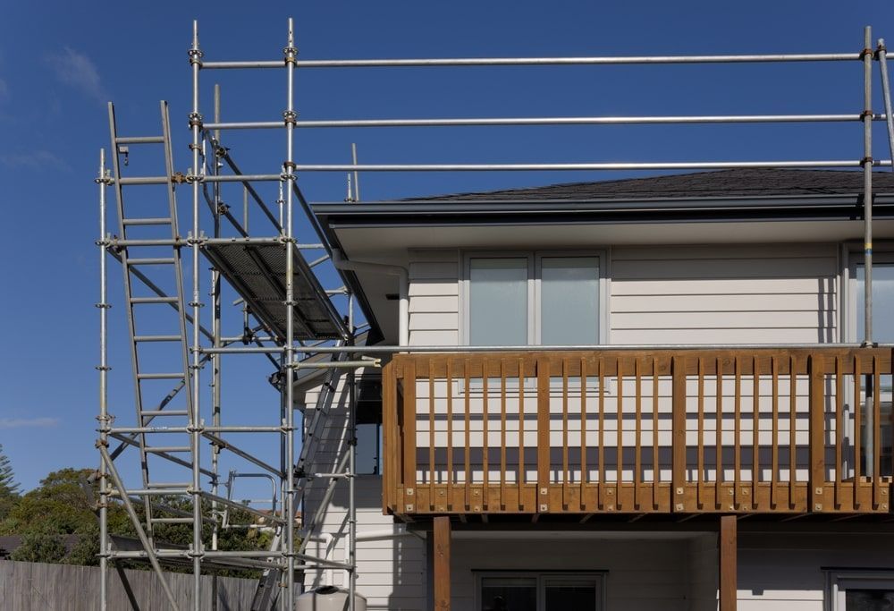Scaffolding set up near a house with a wooden deck — Top Tier Scaffolding In North Lakes, QLD