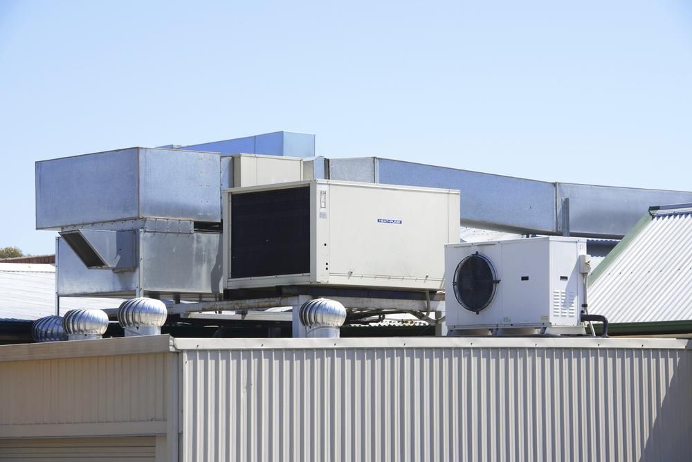 A Large Air Conditioner Is Sitting On Top Of A Building — Jervis Bay Airconditioning In Sanctuary Point, NSW