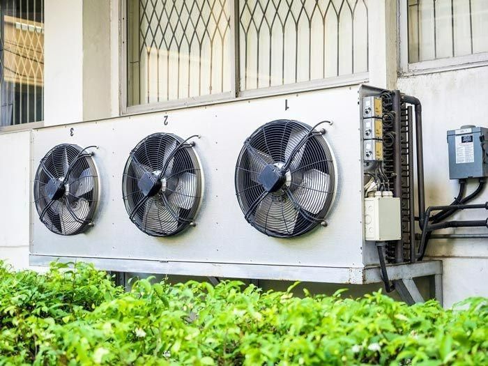 There Are Three Fans On The Side Of A Building — Jervis Bay Airconditioning In Huskisson, NSW