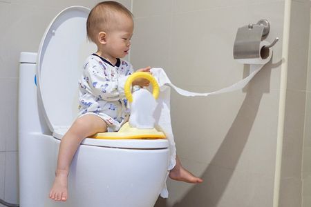 Playful Baby in a Toilet — Meridian, MS — Roto-Rooter Plumbers