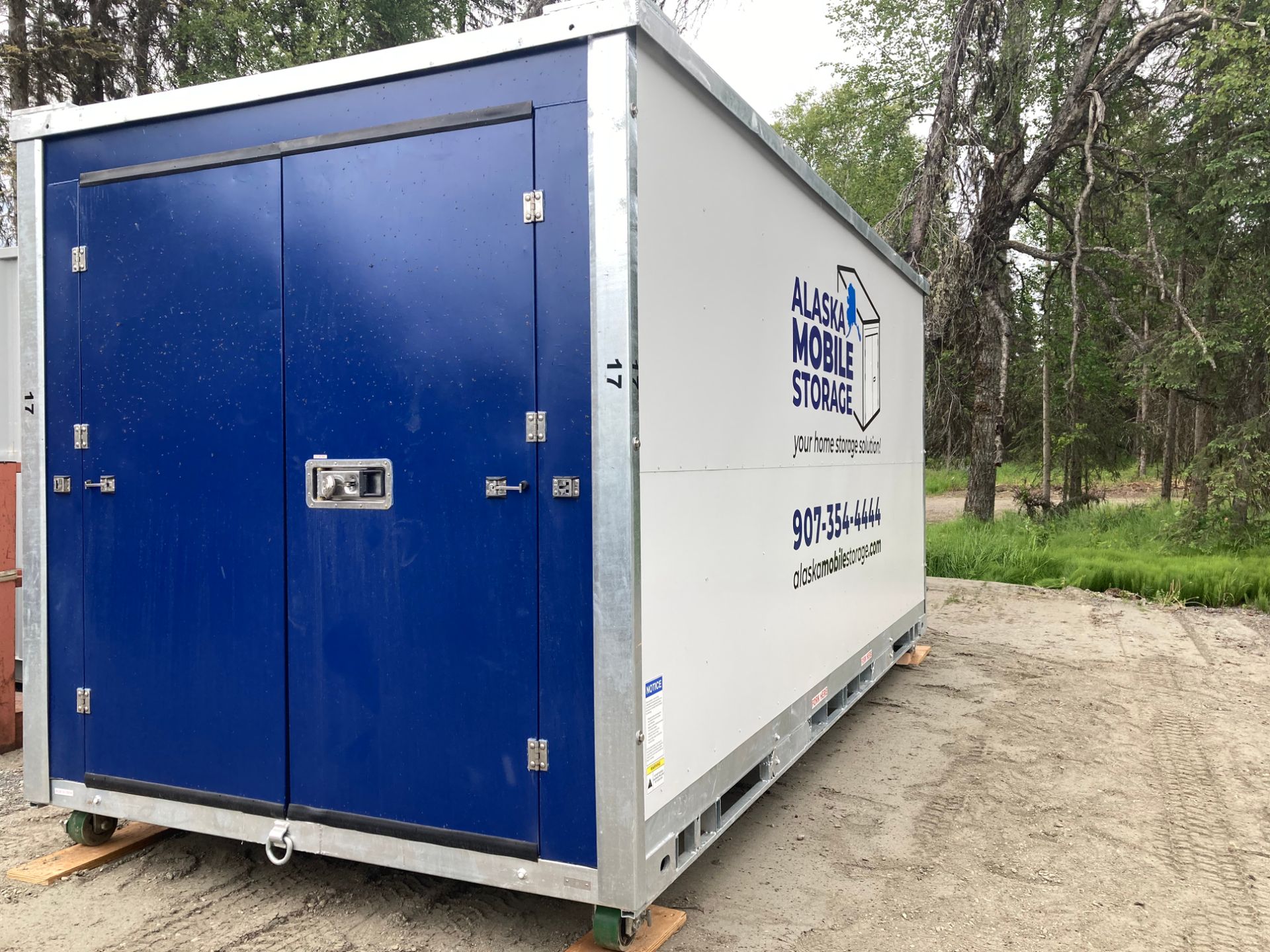 A blue and white container with the word mobile storage on it