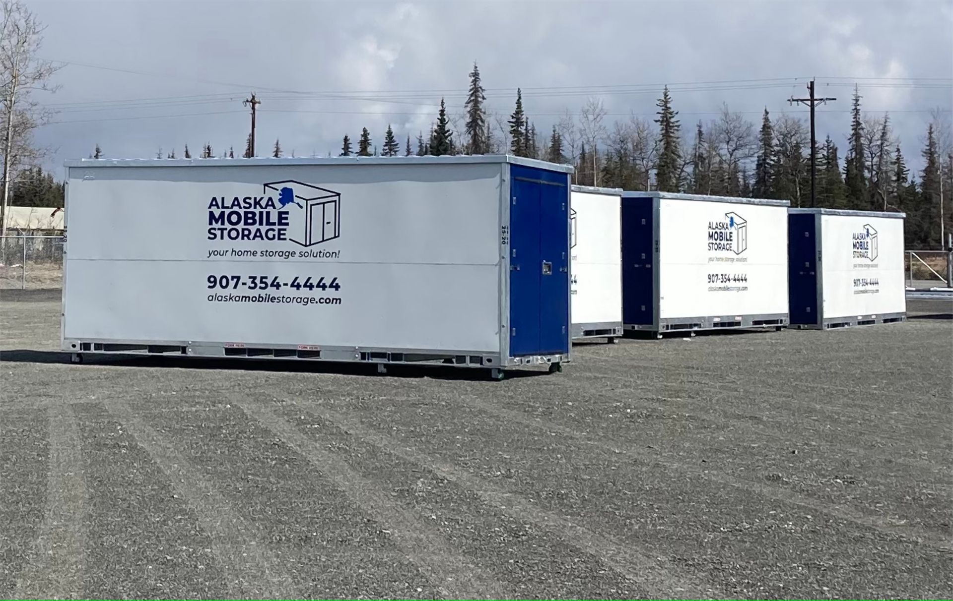 A row of alaskan mobile storage containers in a parking lot