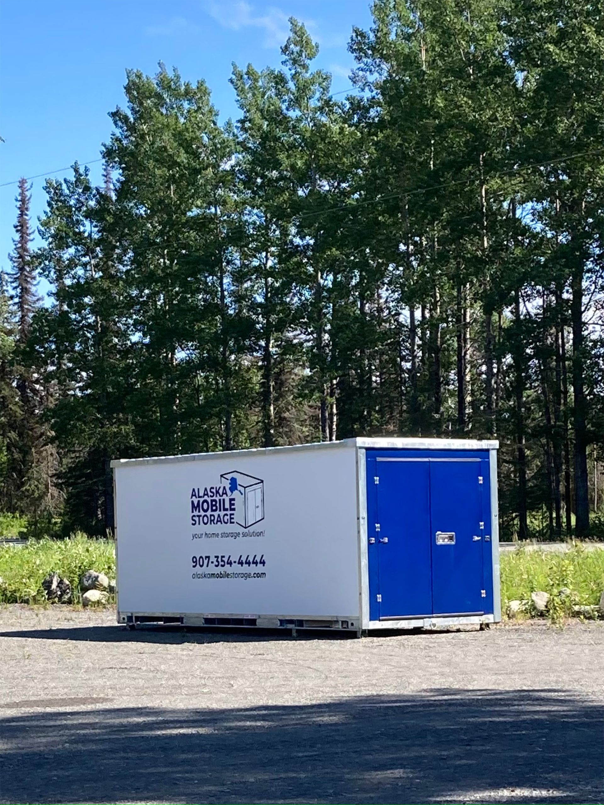 A white box with a blue door that says ' home box ' on it