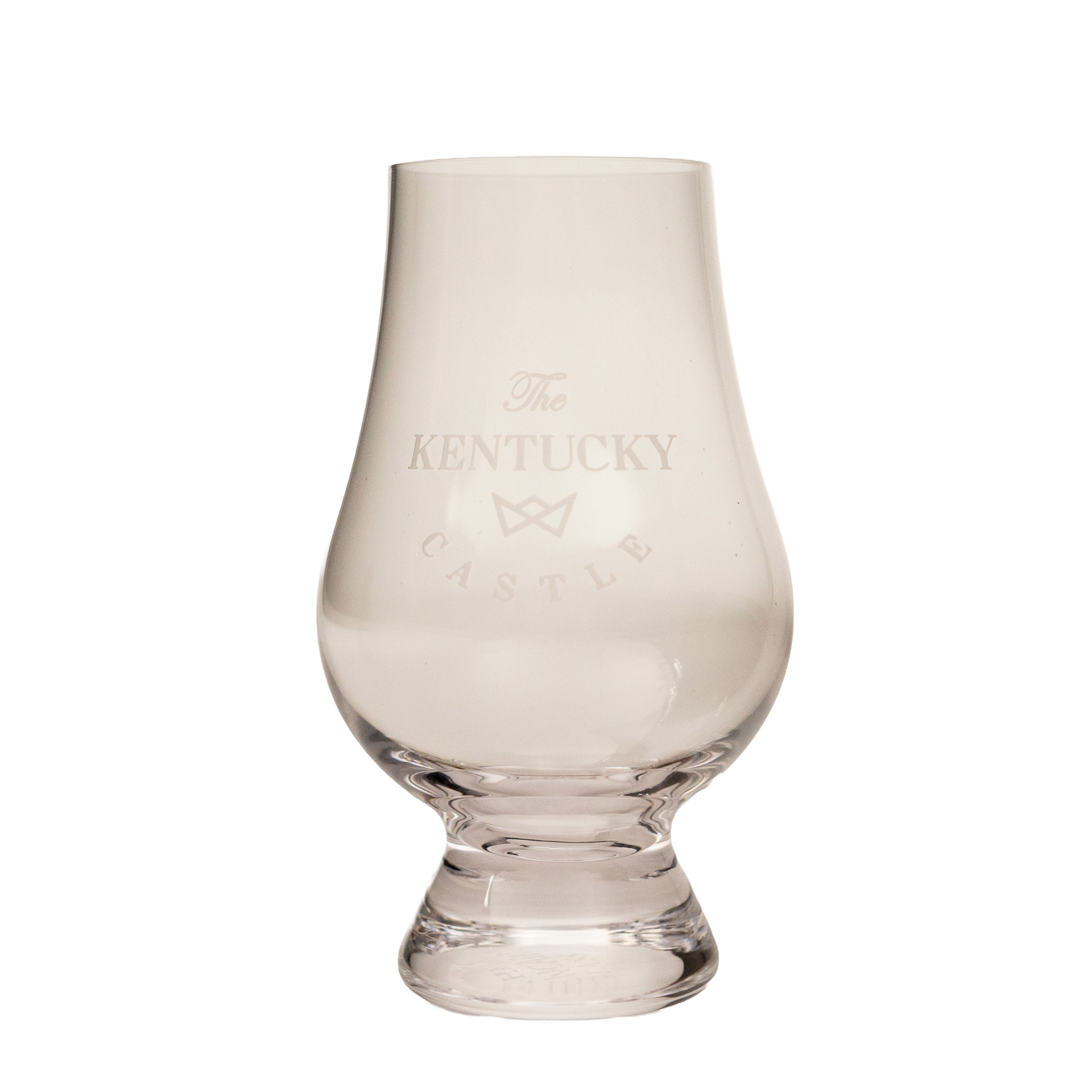 A clear glass tulip-shaped whiskey tasting glass with