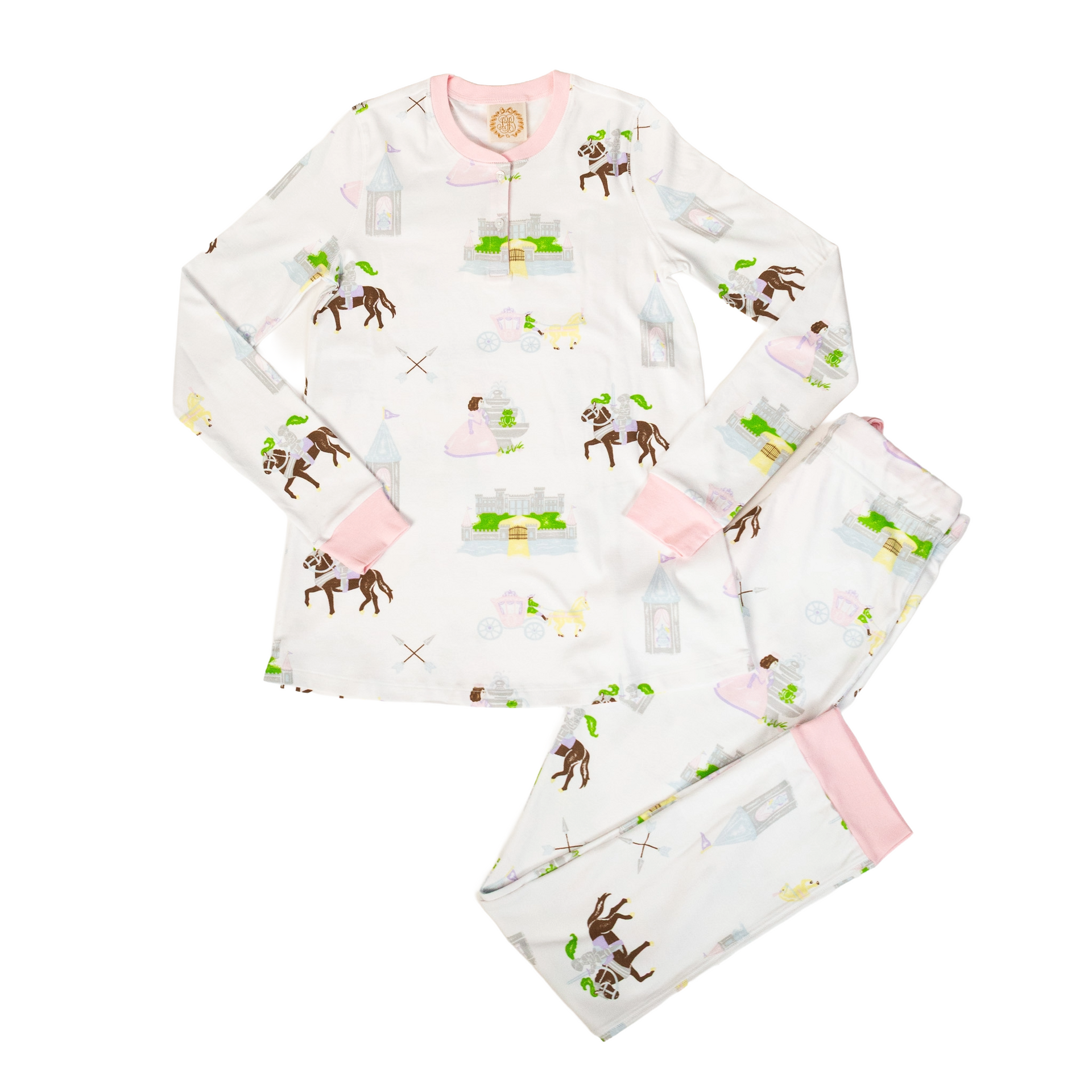 White pajamas with a horse and castle print, trimmed with pink.