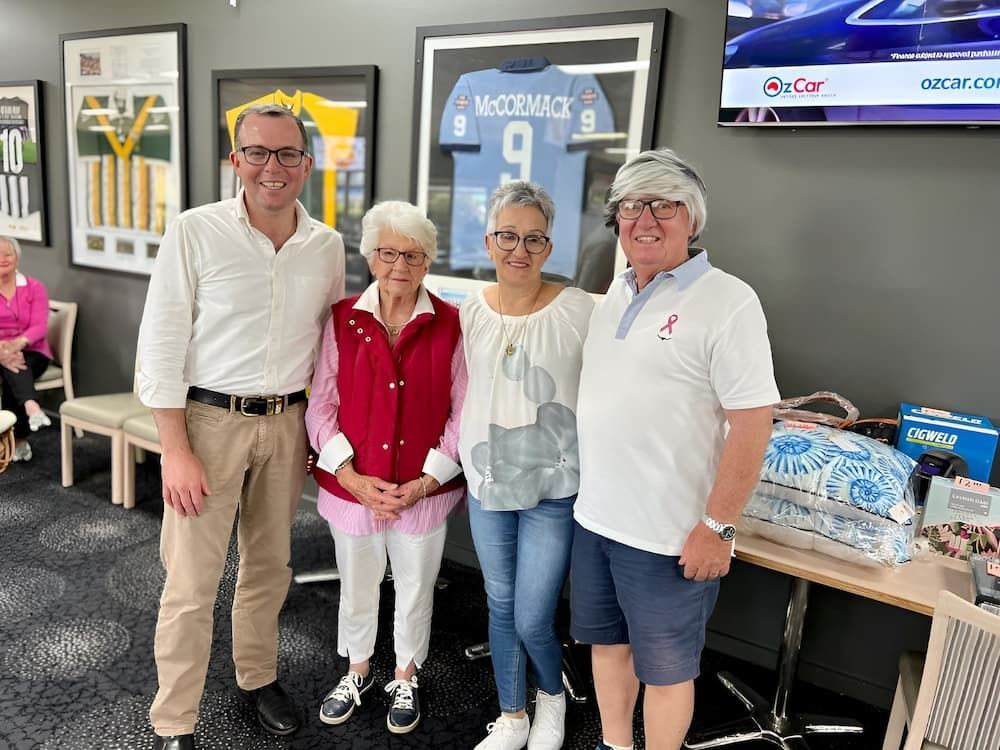 A Group Of People Are Posing For A Picture In A Room — Inverell Sporties in Inverell, NSW