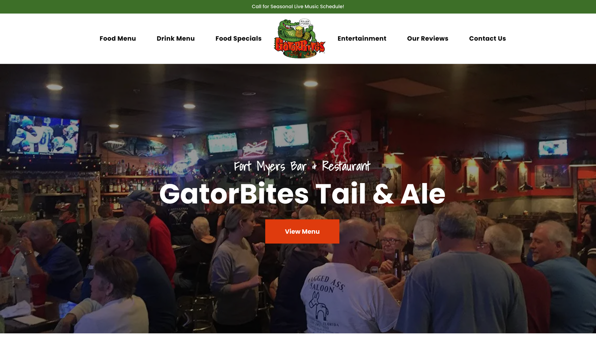 A group of people are sitting at tables in a bar.