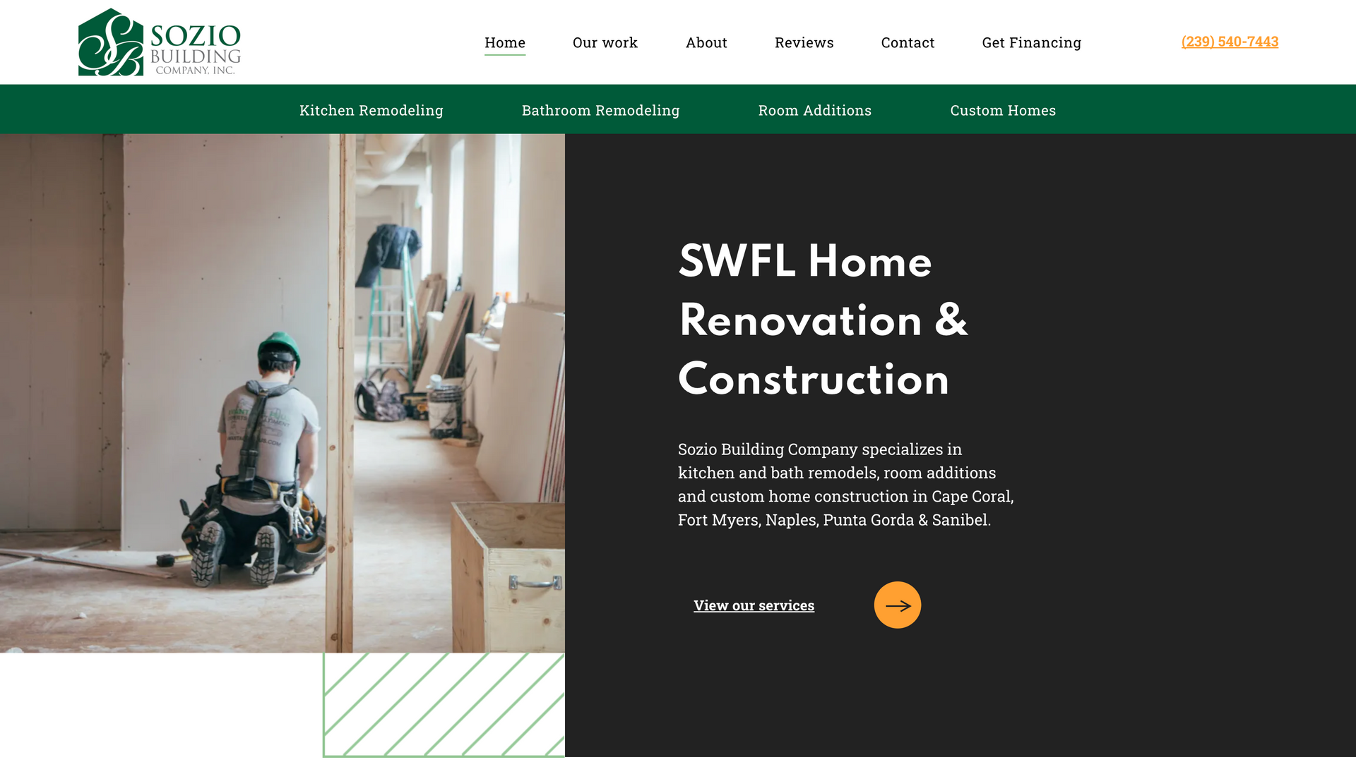 A man is kneeling down in a building under construction.