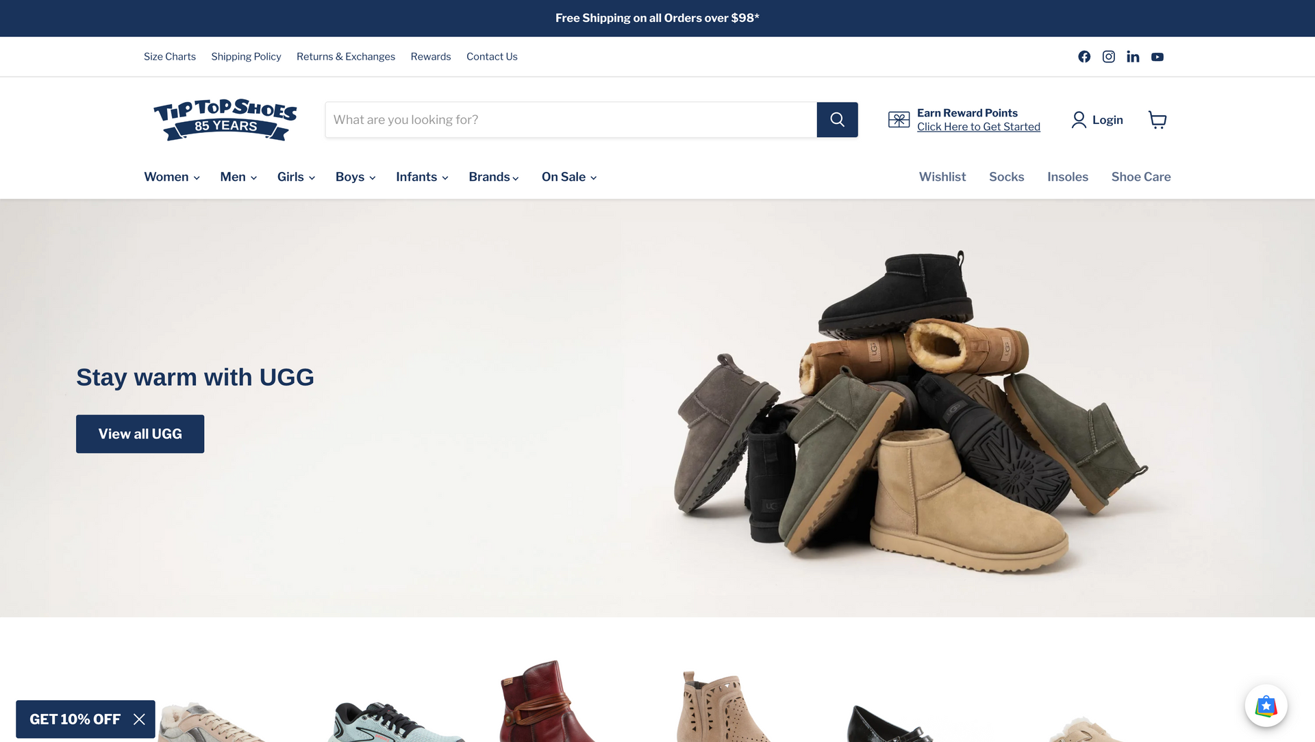 A bunch of shoes are stacked on top of each other on a website.