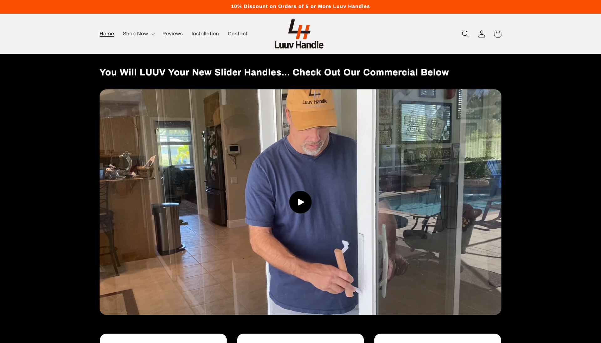 A man in a blue shirt is opening a sliding glass door.