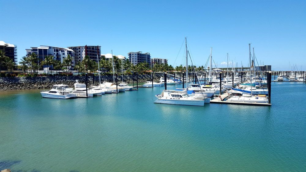 A Row Of Boats Are Docked In A Marina — Mackay Septic Pumping In Mackay, QLD