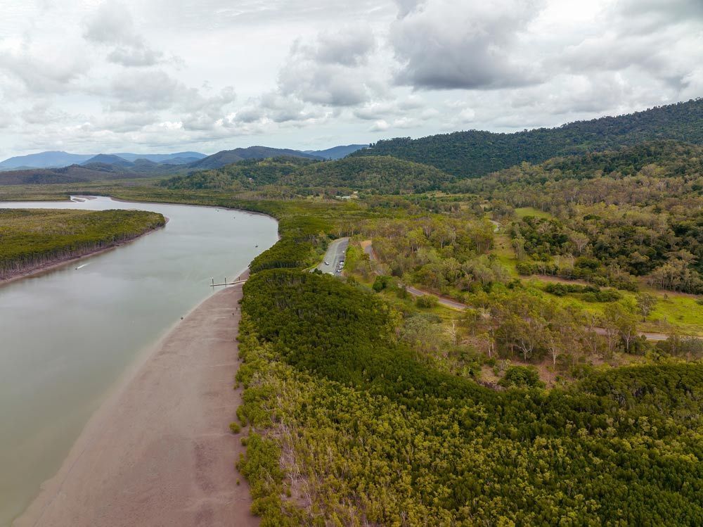 An Aerial View Of A River Surrounded By Trees — Mackay Septic Pumping In Proserpine, QLD