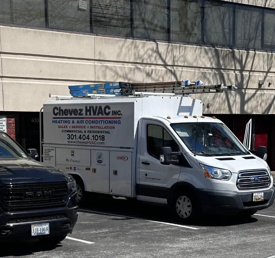 A chavez hvac truck is parked in front of a building