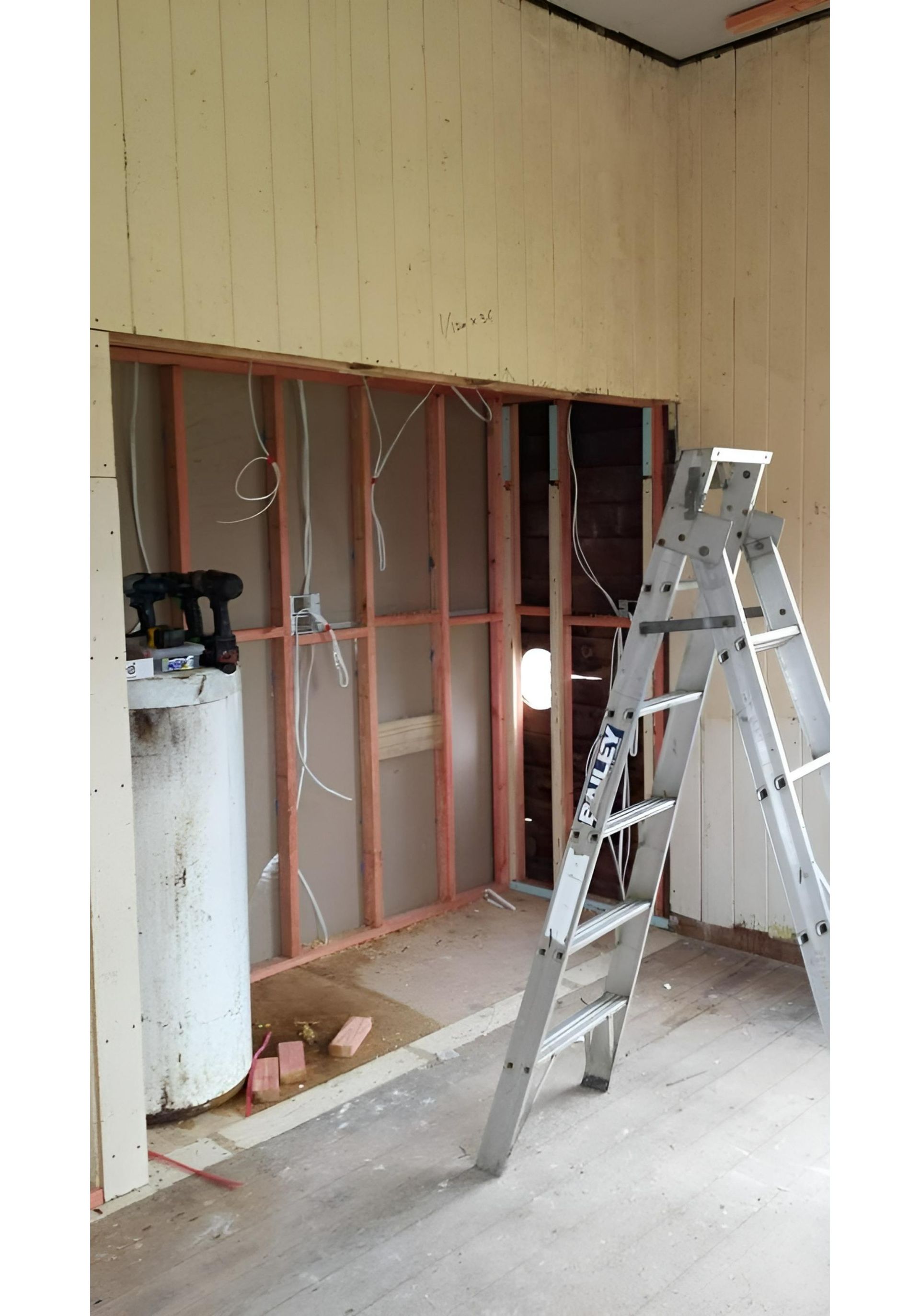A Room With A Ladder And A Water Heater In It — Chris North Electrical In Cooroy, QLD