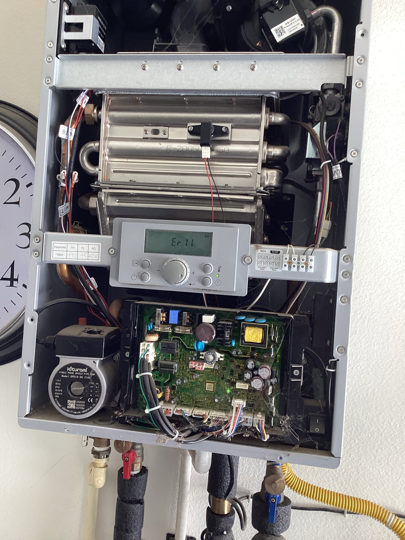 Open gas boiler, display shows 