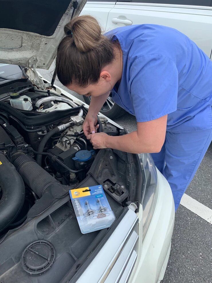 Nurse Fixing a Car — Gainesville, FL — Gainesville Direct Primary Care Physicians LLC