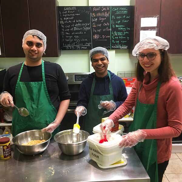 Students baking in the kitchen at Wayne's Cup