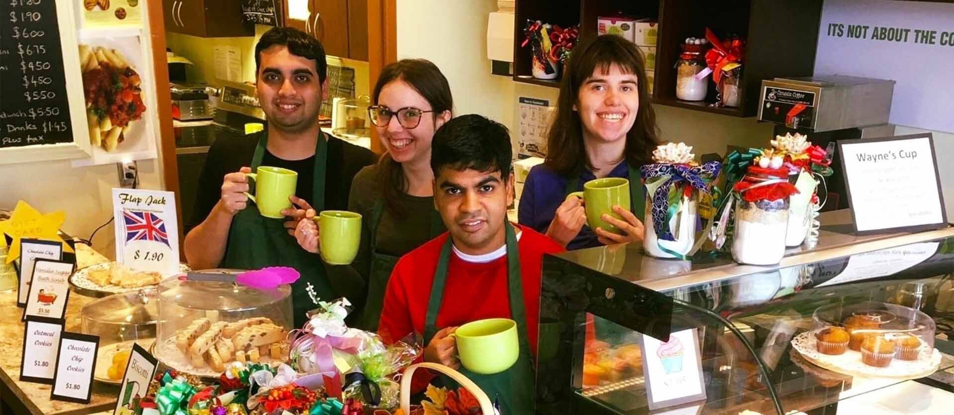 Students with cups of coffee in Wayne's Cup Café