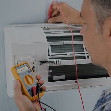 Technician Testing Air Conditioner - R & D Refrigeration, Inc. in Phoenix, AZ