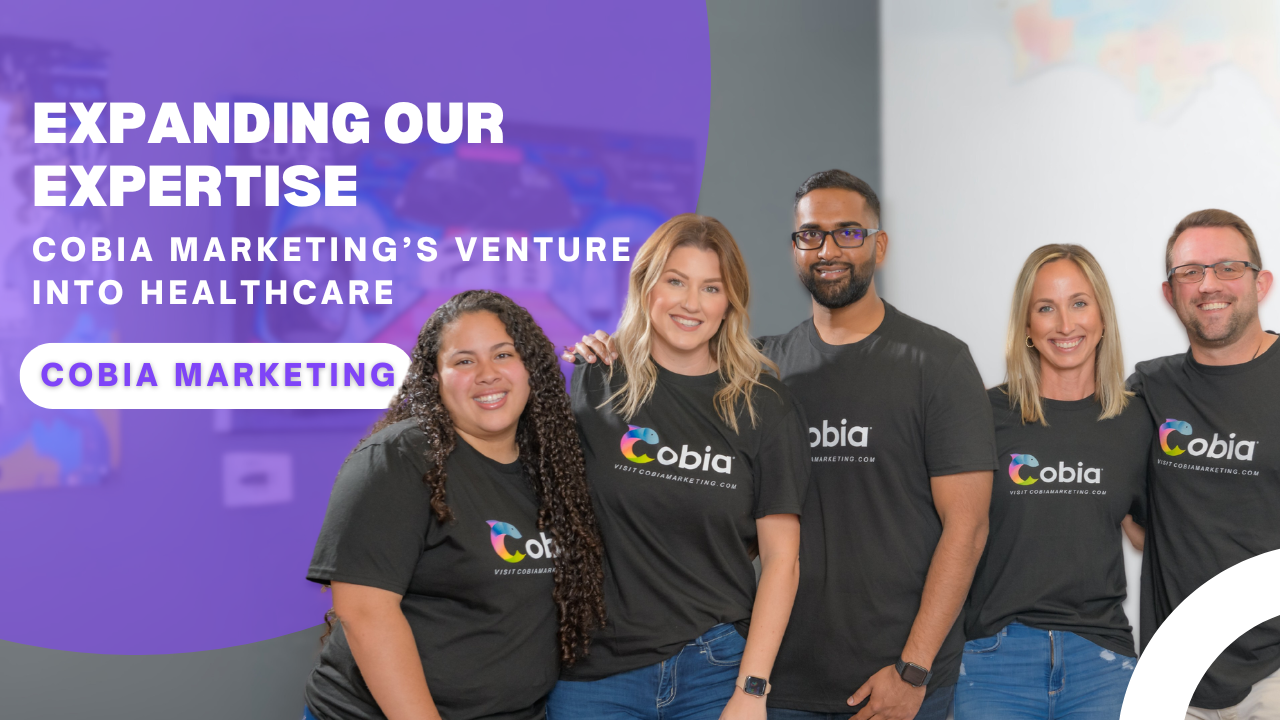 A group of people standing next to each other wearing cobia shirts