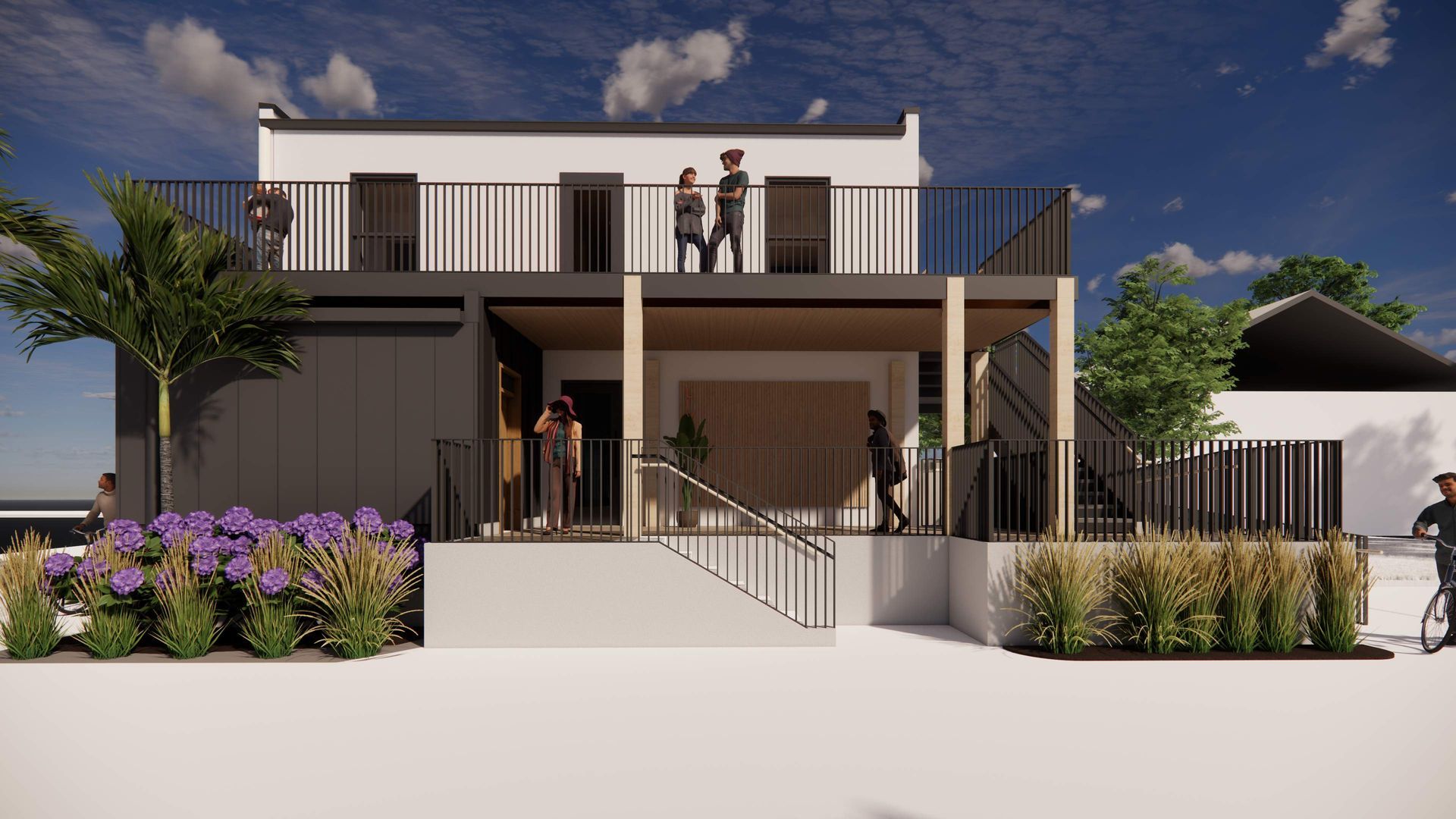 Two-story modern building with people on balconies, black siding, and white walls. Sunny day, bright and airy.