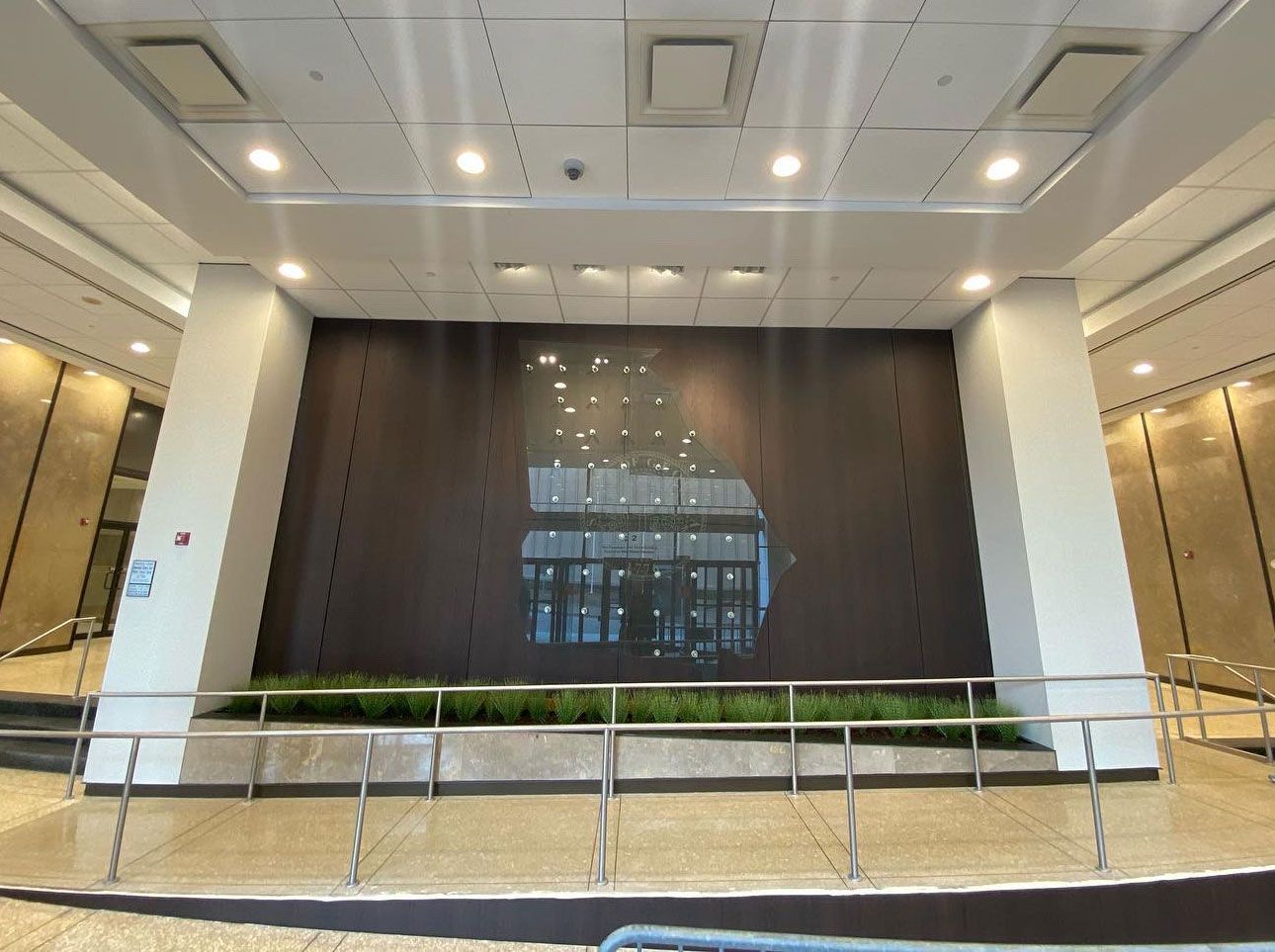 A large wall with a picture of a building on it in a building.