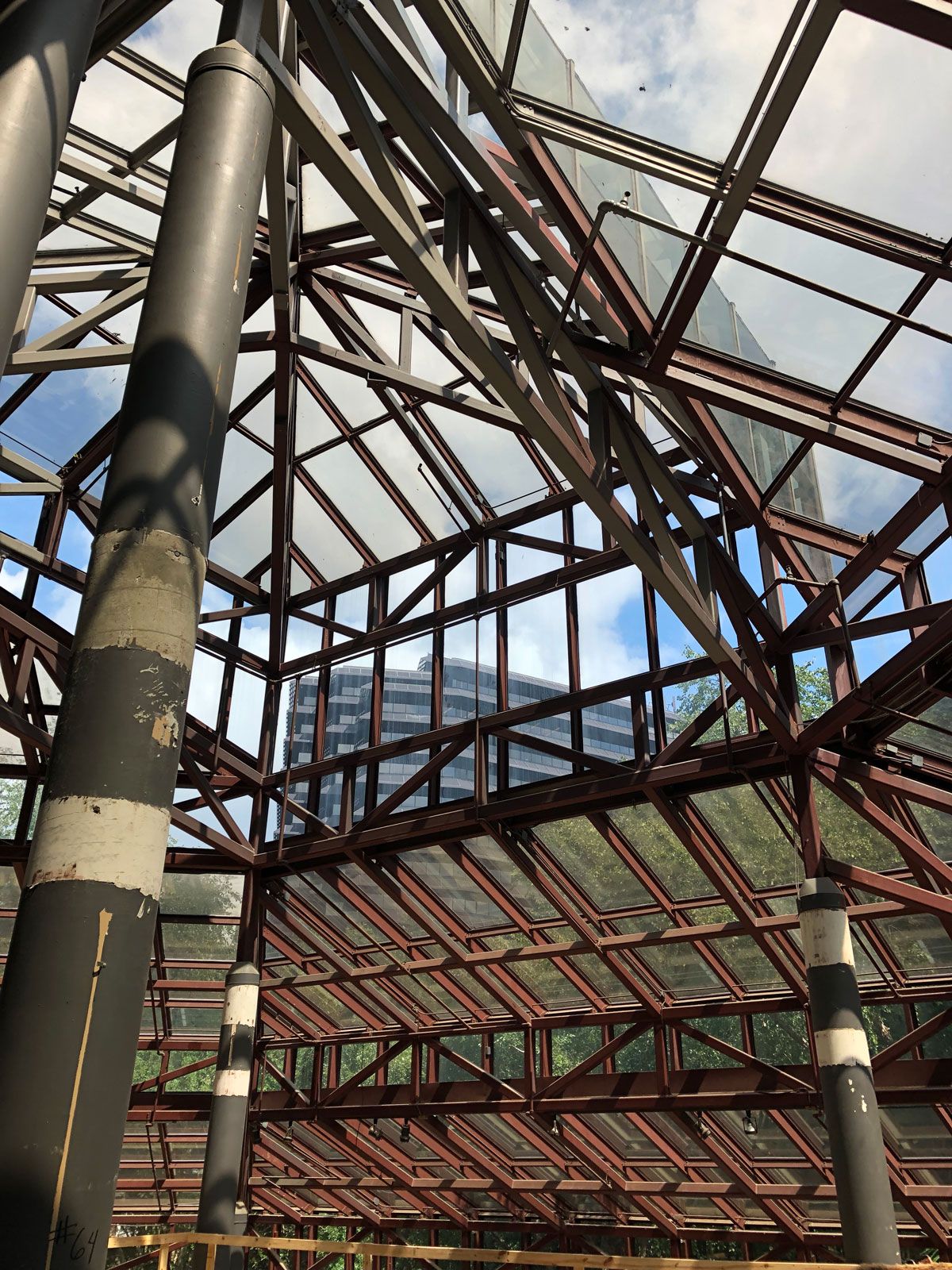 Looking up at the ceiling of a building with a glass roof