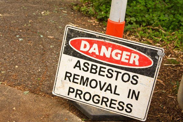 asbestos removal in progress sign