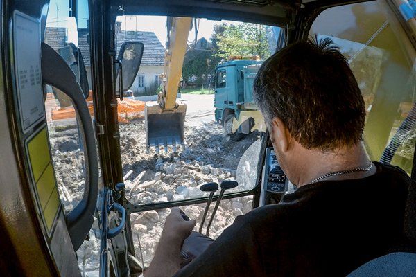 man operating excavator