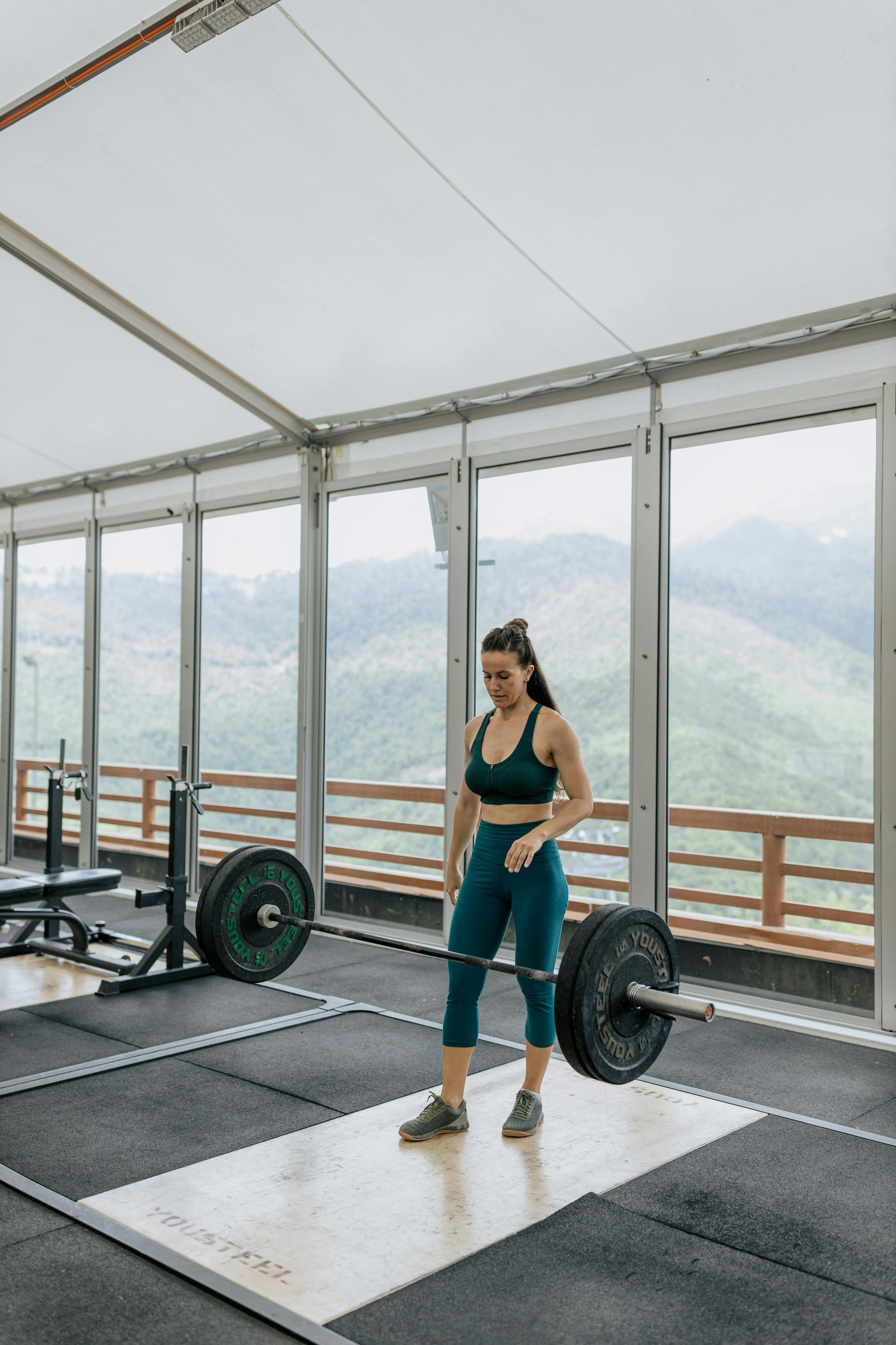 A woman preparing to lift it in a gym as part of her sports performance training