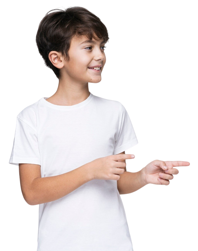 Boy in white shirt pointing to the right, smiling.