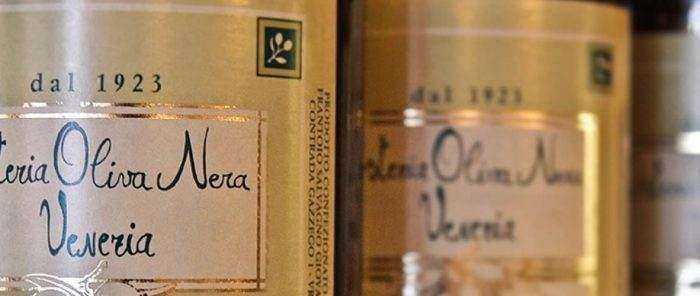 Close-up of gold-colored product tins labeled 