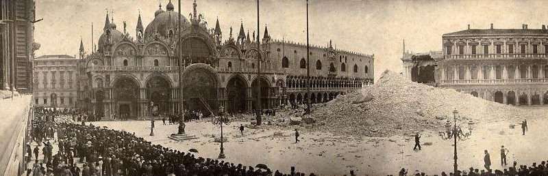 Historical black-and-white photo of a large pile of rubble in St. Mark's Square, Venice, after the Campanile collapse.